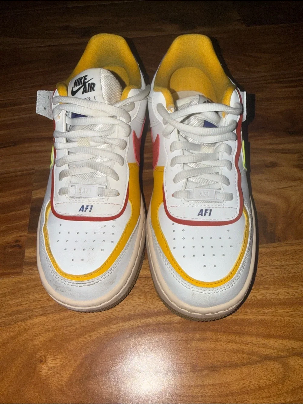 Nike White Low-Top Sneakers with green, Yellow & Red Accents